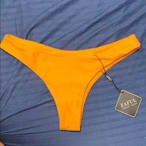 yellow/orange bathing suit bottom